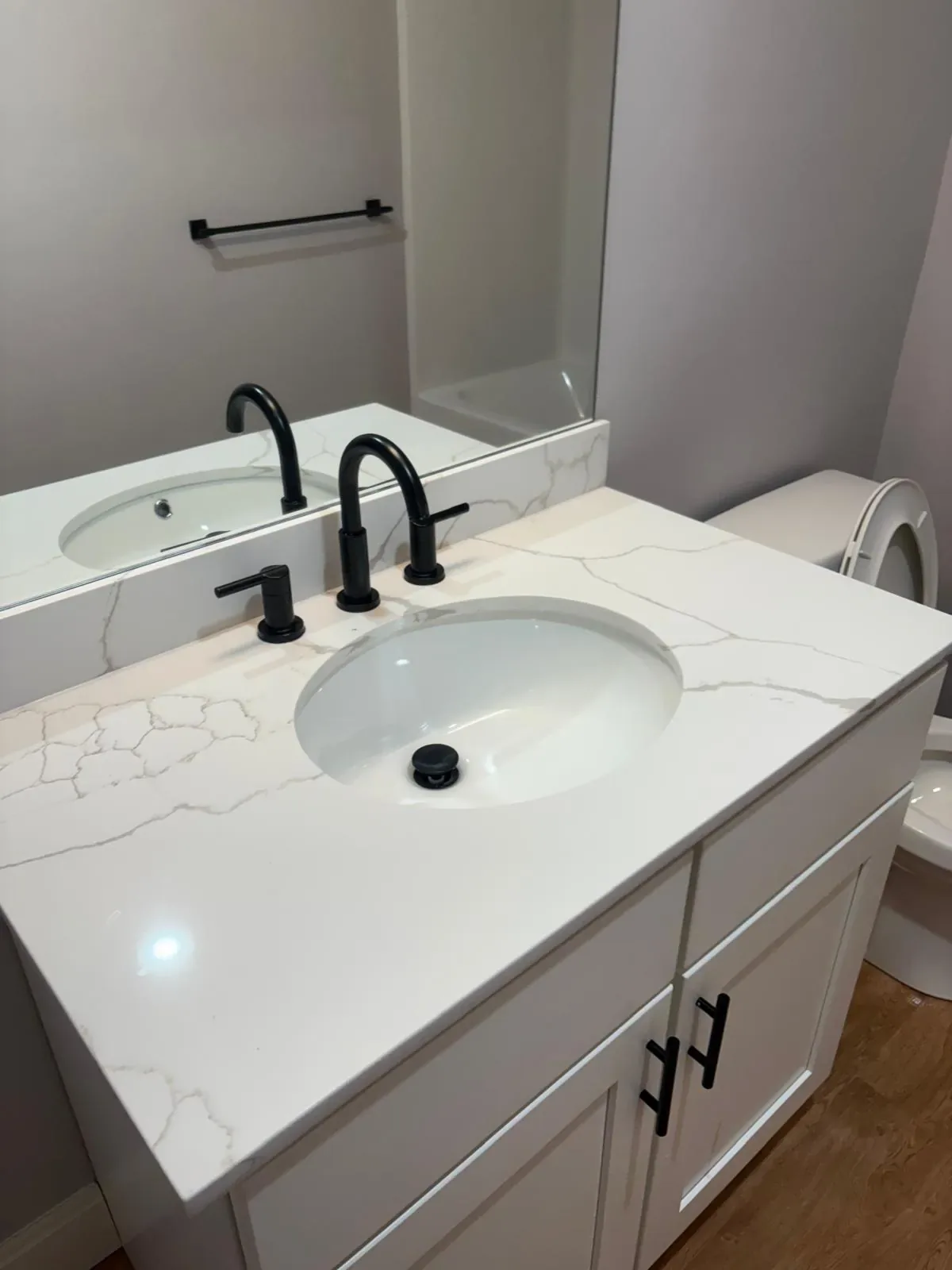 Bathroom vanity and quartz countertop after cleaning